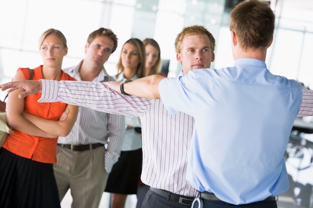 TSA agent searching man