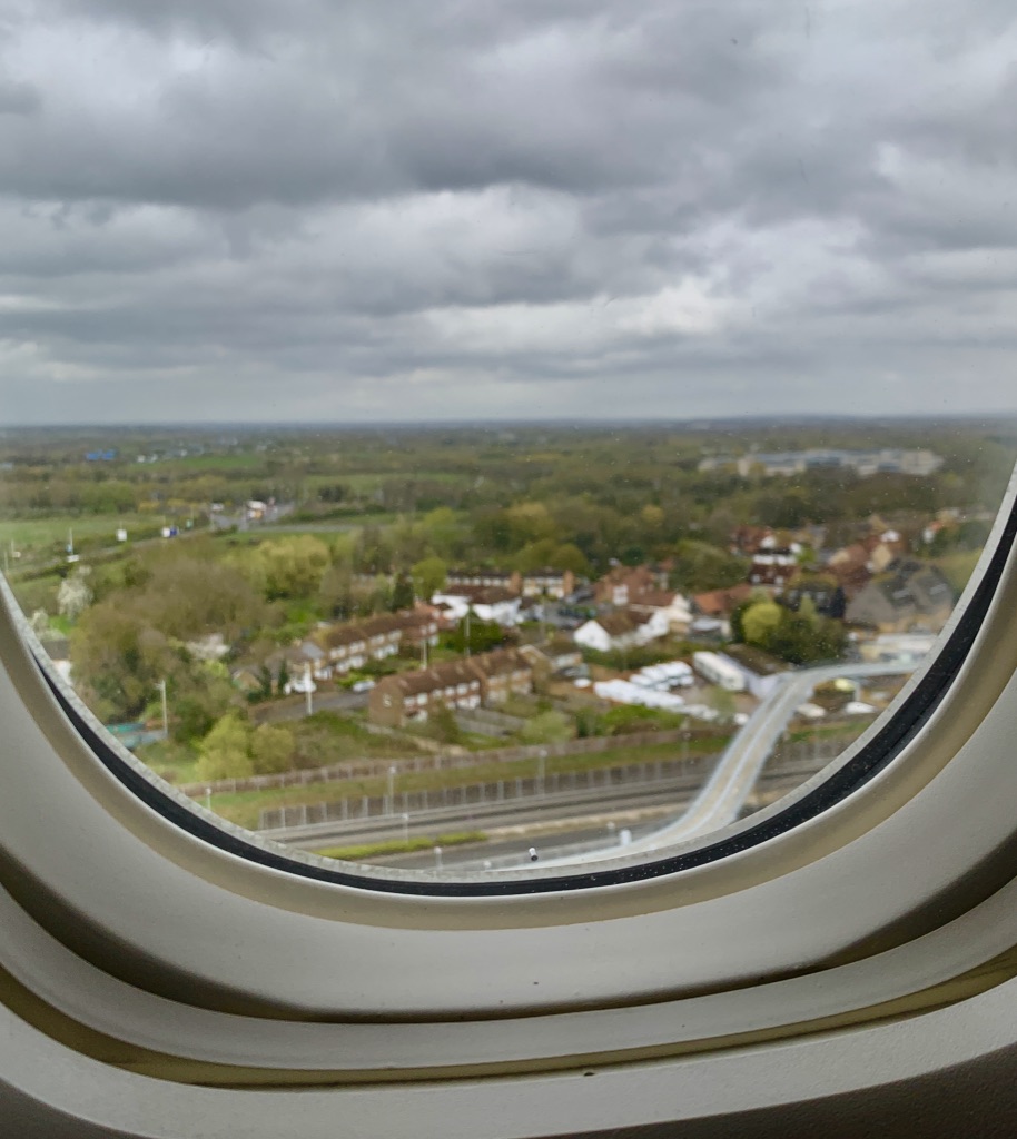 Look outside of plane window as flight lands in London