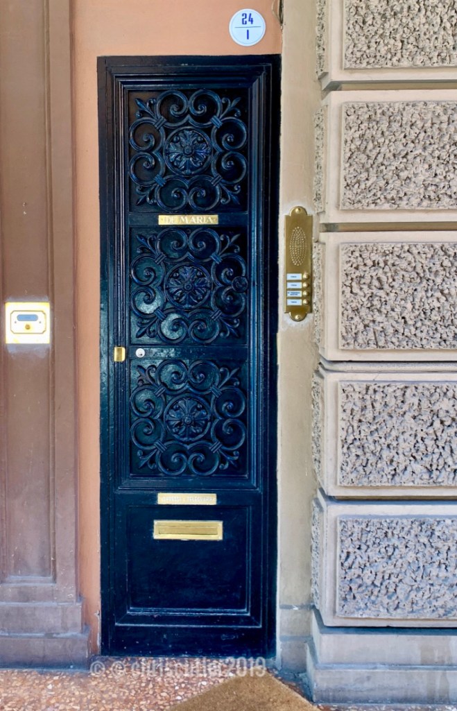 Black wrought iron door in Bologna