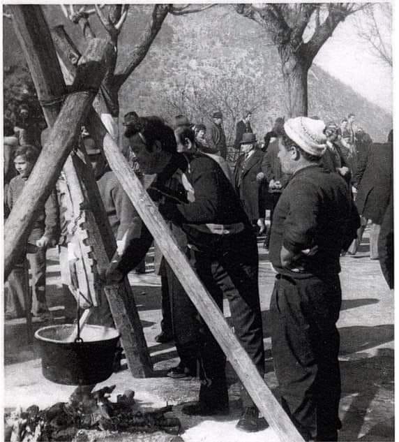 Men stirring a pot of polenta in 1962