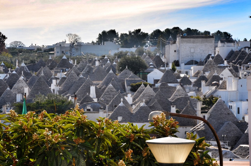 Overview of historic Alberobello with roofs of trulli sticking up