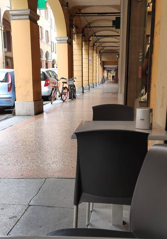 Porticos, no people, empty cafe tables