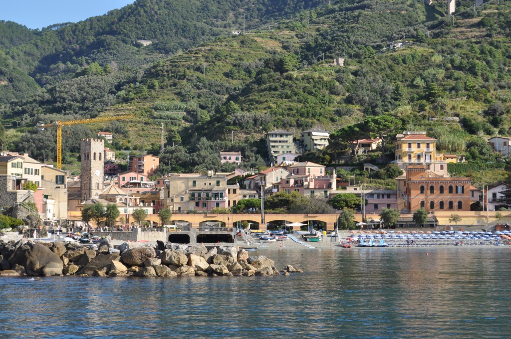 Town with rocks and beach in front